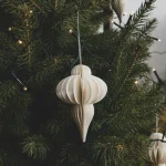 Paper ornament hanging on a Christmas tree