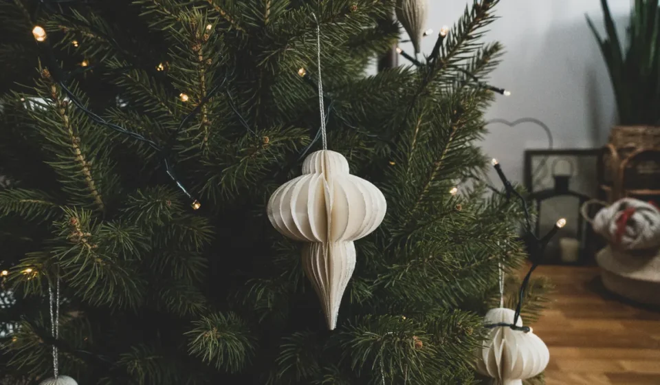 Paper ornament hanging on a Christmas tree